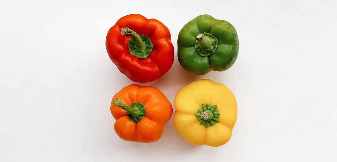 Red, Green, Orange, and Yellow pepper shot from an aerial view